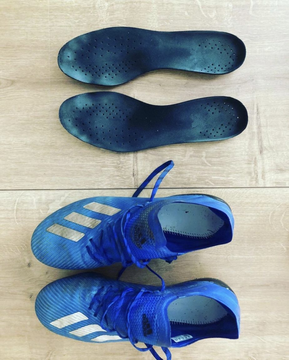 C_h1s shows off the dirty insoles of his Adidas football boots Male