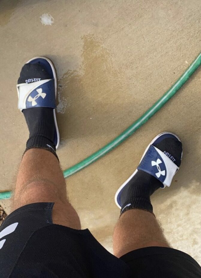 Nicenikesbro in black Nike crew socks and Under Armour slides Male